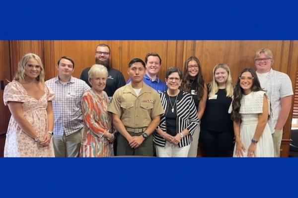 UK students posing with their professor and the mayor of Lexington