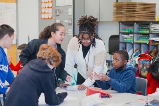 Student teacher working with elementary education students