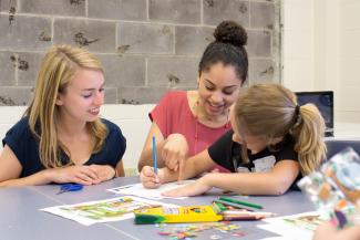 EDC students working with their students.
