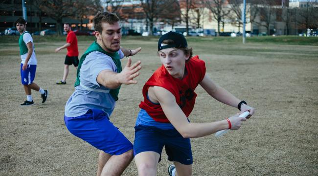 students playing frisbee