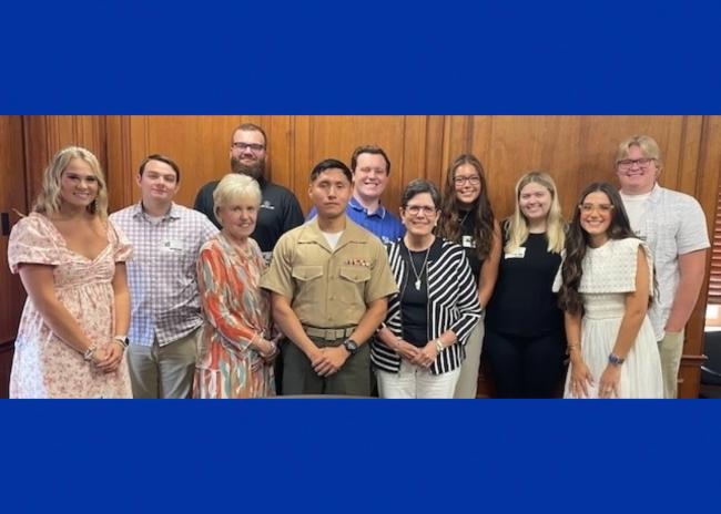 UK students posing with their professor and the mayor of Lexington