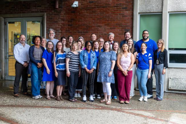 Group of Educational Leadership Studies students poses for a group photo in Dickey and Taylor breezeway