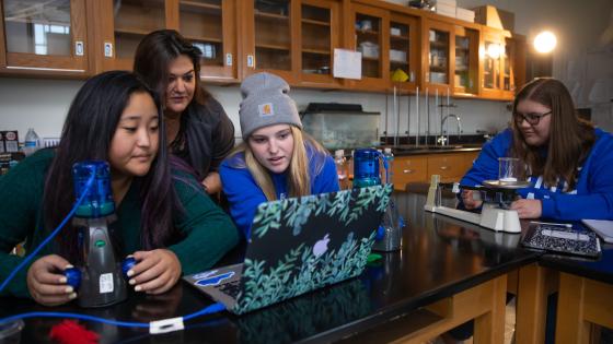 Students in lab with STEM Education faculty