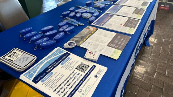 Table with farmer mental health handouts displayed on table